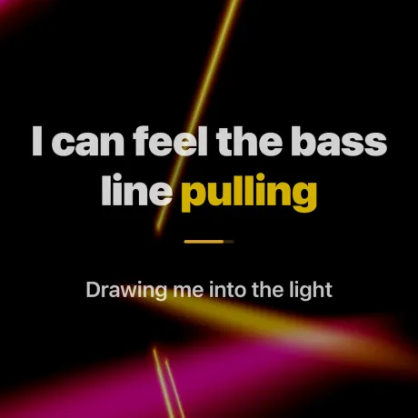 Neon stage — glowing geometric wireframes with synced lyrics
